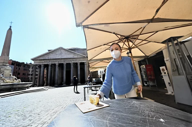 Staff of a coffe-restaurant, brings coffees for customers, in Piazza della Rotonda at the Pantheon, in central Rome, on March 15, 2021, as three-quarters of Italians entered a strict lockdown as the government put in place restrictive measures to fight the rise of COVID-19 infections. (Photo by Andreas SOLARO / AFP) (Photo by ANDREAS SOLARO/AFP via Getty Images) - It may be hard to obtain a European reference from this cafe.